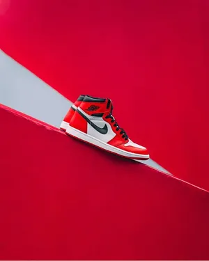 Elevate Your Game With Red Nike Jordan Air 1 Shoes Wallpaper