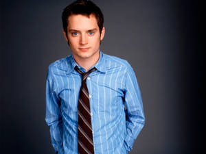 Elijah Wood Wearing Blue Stripe Shirt Wallpaper