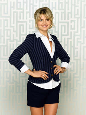 Eliza Coupe Standing In An Elegant Pose Wallpaper