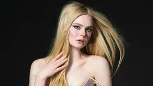 Elle Fanning Displays An Intense And Fierce Look In A Stunning Setting. Wallpaper