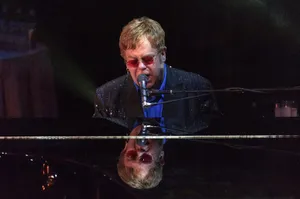 Elton John Concert Piano Reflection Wallpaper