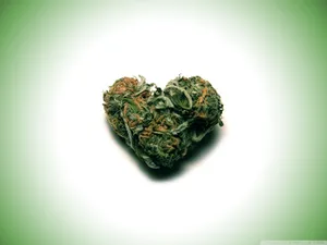 Embrace Love And Luck With This Little Green Weed Heart Wallpaper