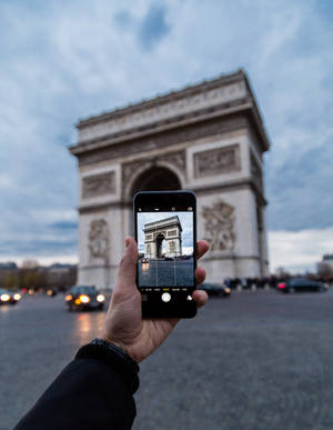 Emily Gazing At The Eiffel Tower In Paris Wallpaper