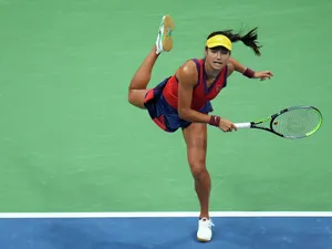 Emma Raducanu Athletic Pose Wallpaper