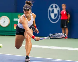 Empowering Stance - Bianca Andreescu At Tennis Court Wallpaper