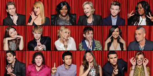 Engaging Glee Cast Against A Theatrical Red Drape Wallpaper