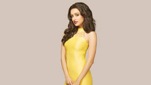 Engrossing Snapshot Of Shraddha Kapoor In A Yellow Dress Wallpaper