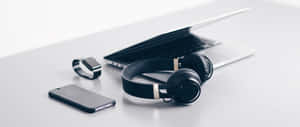 Enhancing Your Laptop Audio With Headphones Wallpaper
