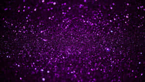 Enjoy A Dazzling Display Of Purple Glitter Wallpaper