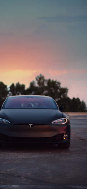 Enjoy A Wireless World With The Tesla Iphone. Wallpaper