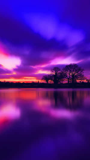 Enjoy The Breathtaking View Of A Blue And Purple Sunset. Wallpaper