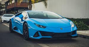 Enjoy The Open Road With An Exotic Blue Lamborghini Aventador. Wallpaper