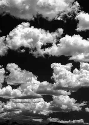 Enjoy The Thunderstorm With The Beautiful Black And White Clouds Wallpaper