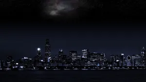 Enthralling Night View Of A Dark City Wallpaper