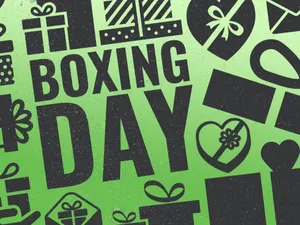 Enthusiastic Shopper Enjoying Boxing Day Sales Wallpaper