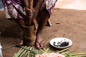 Ethiopia Woman Grinding Coffee Wallpaper