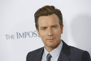 Ewan Mcgregor In A Deep Contemplation Pose Wallpaper