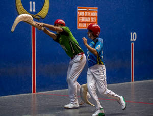 Exciting Action In Jai Alai Match Wallpaper