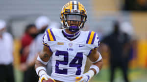 Exciting Young Football Talent Derek Stingley Jr In His Lsu Nike Jersey Wallpaper