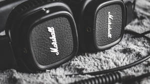 Experience The Power Of Music With Marshall Headphones Wallpaper