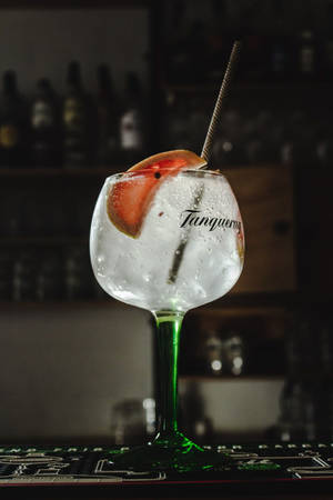 Exquisite Tanqueray Gin In A Goblet Glass Wallpaper