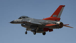 F-16 Fighter Jet In Red Wallpaper