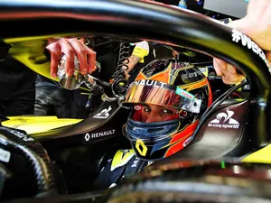 F1 Driver Esteban Ocon Racing In Full Throttle Wallpaper