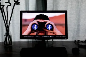 Facebook On Binoculars Wallpaper