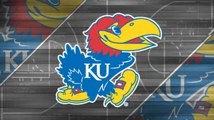 Fans Supporting Their Favorite Team, The Kansas Jayhawks, At A Basketball Game. Wallpaper