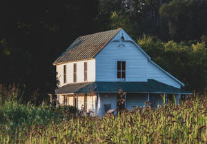 Farmhouse With Wheat Crops Wallpaper