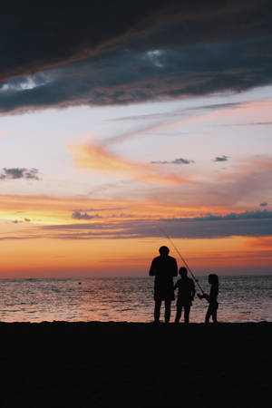 Father And Children On A Fishing Adventure Wallpaper