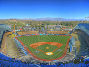Feel The Excitement Of A Dodger Game At Dodgers Stadium Wallpaper