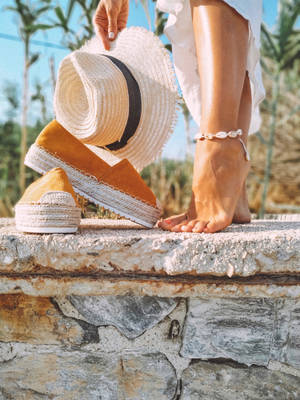 Feet On A Rough Concrete Ledge Wallpaper