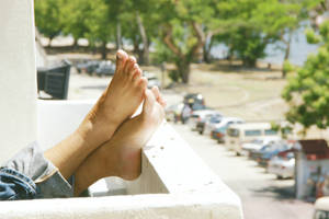 Feet On An Overlooking Balcony Wallpaper