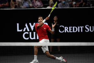 Felix Auger-aliassime In Solid Receive Stance During A Match Wallpaper