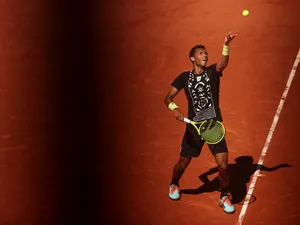 Felix Auger Aliassime Throwing Ball To Serve Wallpaper
