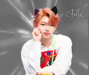 Felix Of Stray Kids Beaming With Confident Energy Wallpaper