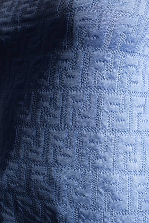 Fendi Designer Logo On Blue Fabric Wallpaper