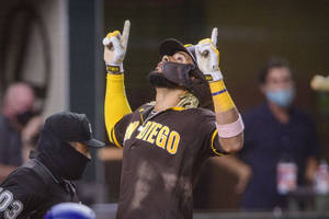Fernando Tatis Jr Lording Over The Mlb Wallpaper