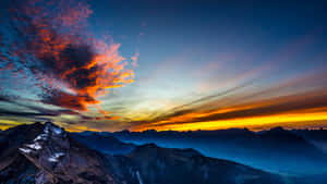 Fiery_ Sky_ Over_ Mountain_ Range Wallpaper