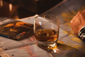 Fine And Rare Whiskey Glass On World Map Wallpaper