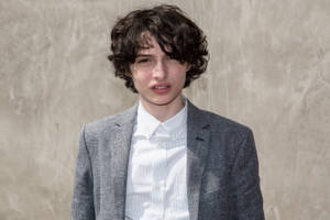 Finn Wolfhard Modeling Coat Wallpaper