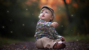 Fireflies And Child Bokeh Effect Wallpaper