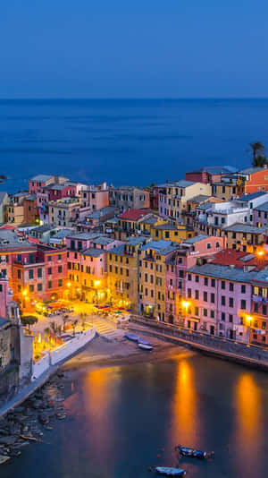 Fishing Village In Portofino Italy During Nighttime Wallpaper