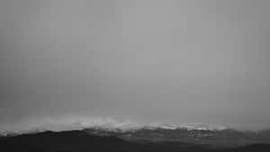 Foggy Mountain Range In Grey Desktop Wallpaper