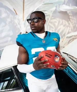 Football_ Player_with_ Sunglasses_and_ Ball Wallpaper
