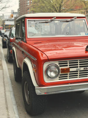 Ford Bronco With Glossy Red Paint Wallpaper