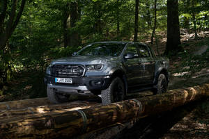 Ford Raptor Crossing Wooden Log Bridge Wallpaper