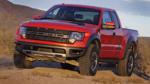 Ford Raptor In Metallic Orange Paint Wallpaper