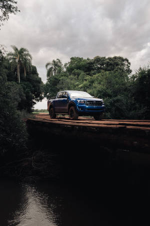 Ford Raptor Over A Wooden Bridge Wallpaper